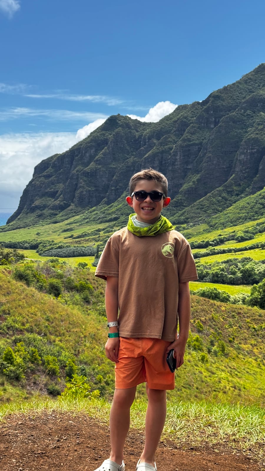 Landon smiling outside on an adventure